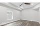 Bedroom with a large window and modern vinyl floors, offering a bright and clean space at 2257 E Brookside Ave, Indianapolis, IN 46218