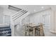 Spacious dining room features gray walls, wood floors, and natural light at 2257 E Brookside Ave, Indianapolis, IN 46218