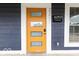 Close-up of the front door featuring sidelights, modern design, and new hardware at 2257 E Brookside Ave, Indianapolis, IN 46218