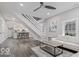 Bright and airy living room with a staircase, offering a comfortable and stylish space at 2257 E Brookside Ave, Indianapolis, IN 46218