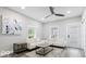 Inviting living room with modern furnishings, a ceiling fan, and natural light from the window at 2257 E Brookside Ave, Indianapolis, IN 46218