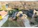 An aerial view of an elegant brick home featuring a sprawling lawn and a convenient attached two-car garage at 2487 Wayward Wind Dr, Indianapolis, IN 46239