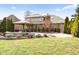 Expansive backyard with a partially covered pool, green grass and mature trees at 2487 Wayward Wind Dr, Indianapolis, IN 46239