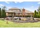 Spacious backyard featuring a partially covered in-ground pool and a two-story home at 2487 Wayward Wind Dr, Indianapolis, IN 46239