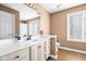 Well-lit bathroom with vanity and tiled floors at 2487 Wayward Wind Dr, Indianapolis, IN 46239