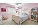 Charming bedroom featuring a bed with a colorful quilt and decor at 2487 Wayward Wind Dr, Indianapolis, IN 46239