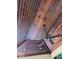 Close-up of the stained wood plank ceiling on the outdoor patio with a ceiling fan and recessed lights at 2487 Wayward Wind Dr, Indianapolis, IN 46239