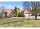 Beautiful brick home with a large front lawn and mature trees shading the property at 2487 Wayward Wind Dr, Indianapolis, IN 46239