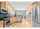 Bright kitchen with stainless steel appliances, sleek countertops, and a breakfast nook at 2487 Wayward Wind Dr, Indianapolis, IN 46239