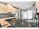 Well-lit kitchen featuring stainless steel appliances, mosaic backsplash, and granite countertops at 2487 Wayward Wind Dr, Indianapolis, IN 46239
