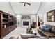 Spacious living room featuring vaulted ceilings, fireplace, and a large comfortable sofa at 2487 Wayward Wind Dr, Indianapolis, IN 46239