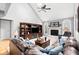 Spacious living room featuring vaulted ceilings, fireplace, and a large comfortable sofa at 2487 Wayward Wind Dr, Indianapolis, IN 46239
