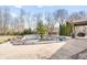 Backyard with a covered pool with a dark cover surrounded by a concrete patio at 2487 Wayward Wind Dr, Indianapolis, IN 46239
