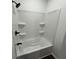 Bathroom features a shower and tub combo with black hardware at 2819 Walker Ave, Indianapolis, IN 46203