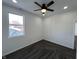 Bright bedroom with ceiling fan, window and neutral paint at 2819 Walker Ave, Indianapolis, IN 46203