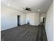 Spacious bedroom with plush carpet, neutral walls, and modern ceiling fan at 2819 Walker Ave, Indianapolis, IN 46203