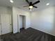 A bright bedroom with carpet, ceiling fan and a closet at 2819 Walker Ave, Indianapolis, IN 46203