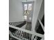 View of the entryway with high ceilings, chandelier, and staircase with iron spindles at 2819 Walker Ave, Indianapolis, IN 46203