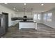 Modern kitchen boasts an island, stainless steel appliances, and classic white cabinetry at 2819 Walker Ave, Indianapolis, IN 46203