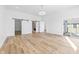 Bright bedroom with sliding doors, barn doors to bathroom, and modern flooring at 3238 Guilford Ave, Indianapolis, IN 46205