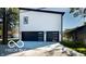 Exterior view of modern home with garage doors and a paved driveway at 3238 Guilford Ave, Indianapolis, IN 46205