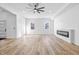Spacious, bright living room with modern fireplace and hardwood floors at 3238 Guilford Ave, Indianapolis, IN 46205