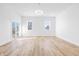 Bright, open living room features sleek flooring, modern lighting, and outdoor access at 3238 Guilford Ave, Indianapolis, IN 46205