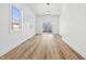 Open-concept living room with natural light, modern lighting, and backyard access at 3238 Guilford Ave, Indianapolis, IN 46205