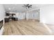 Open-concept living room with modern lighting and hardwood floors at 3238 Guilford Ave, Indianapolis, IN 46205