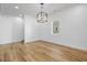 Bright room with modern lighting and hardwood floors at 3238 Guilford Ave, Indianapolis, IN 46205