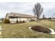 Spacious backyard featuring a covered patio and well-maintained landscaping at 4033 Oak Trail Dr, Indianapolis, IN 46237