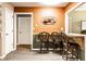 Breakfast bar with seating for three, warm colors, and modern flooring at 4033 Oak Trail Dr, Indianapolis, IN 46237