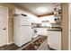 Bright kitchen with white cabinets, laminate countertops, and modern appliances at 4033 Oak Trail Dr, Indianapolis, IN 46237
