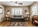 Bright living room with cozy seating, large bay window, and hardwood floors at 4033 Oak Trail Dr, Indianapolis, IN 46237