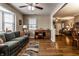 Inviting living room showcasing hardwood floors, comfortable seating, and a view into an adjacent room at 4033 Oak Trail Dr, Indianapolis, IN 46237