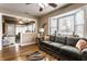 Relaxing living room featuring hardwood floors, a comfortable couch, and a view through an open doorway at 4033 Oak Trail Dr, Indianapolis, IN 46237