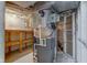 Basement with a furnace, ductwork, wood storage shelf, and a window at 4139 N Grand Ave, Indianapolis, IN 46226
