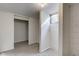 Finished basement area with gray wood-look flooring, white walls and window at 4139 N Grand Ave, Indianapolis, IN 46226