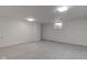 Spacious basement featuring neutral walls, updated flooring, and natural light from a window at 4139 N Grand Ave, Indianapolis, IN 46226