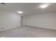 Large basement area showcasing neutral walls, updated flooring, and a doorway at 4139 N Grand Ave, Indianapolis, IN 46226