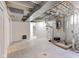 Spacious unfinished basement with updated flooring, visible ductwork, and exposed plumbing at 4139 N Grand Ave, Indianapolis, IN 46226