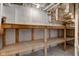 Basement with wood storage shelving and concrete walls and floors at 4139 N Grand Ave, Indianapolis, IN 46226