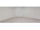 Basement featuring neutral walls, updated flooring, and a white door at 4139 N Grand Ave, Indianapolis, IN 46226