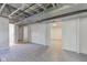 Unfinished basement with updated flooring and visible ductwork, offering potential for customization at 4139 N Grand Ave, Indianapolis, IN 46226