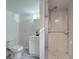 Basement bathroom features a toilet, vanity with sink, and walk-in shower at 4139 N Grand Ave, Indianapolis, IN 46226