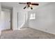 Bright bedroom with neutral carpet, ceiling fan, closet, and natural light from a window at 4139 N Grand Ave, Indianapolis, IN 46226