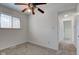 Inviting bedroom features soft carpet, ceiling fan, and a window for natural light at 4139 N Grand Ave, Indianapolis, IN 46226