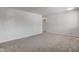 A bright room with neutral carpet, white walls, and a doorway leading to a hallway at 4139 N Grand Ave, Indianapolis, IN 46226