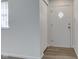 Bright foyer with neutral walls, modern flooring, closet, and a front door with diamond accent at 4139 N Grand Ave, Indianapolis, IN 46226