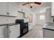 Modern kitchen features white cabinetry, ample counter space, and is designed for efficient cooking and meal preparation at 4139 N Grand Ave, Indianapolis, IN 46226